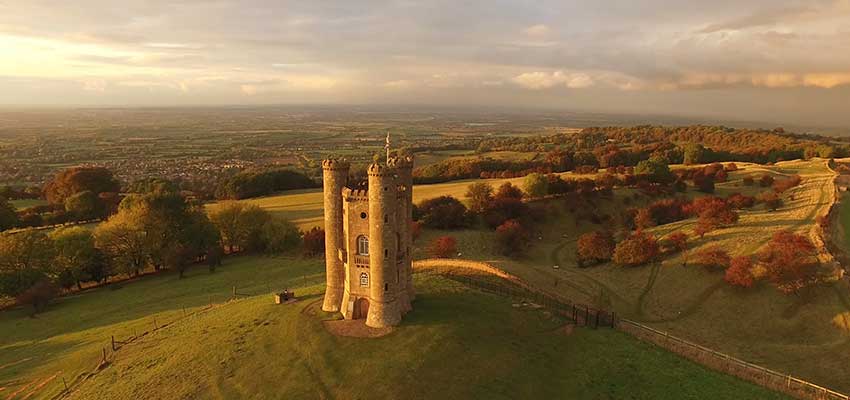 Autumnal hues surround the Broadway Tower in the Cotswolds